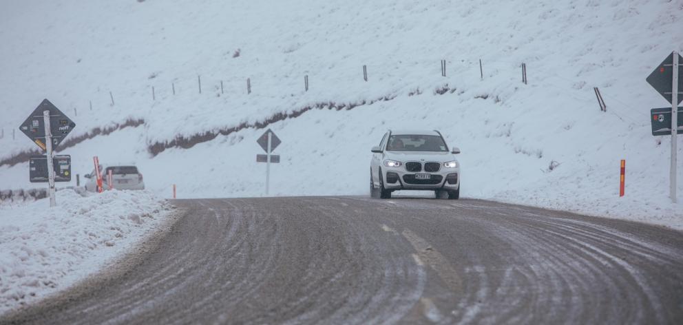 The Crown Range linking Queenstown and Wānaka is open, but chains must be carried. Photo: Rhyva...