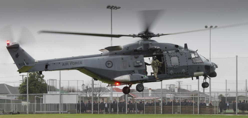King’s High School pupils watch as an NH90 helicopter lands on the school’s field. PHOTOS: GERARD...