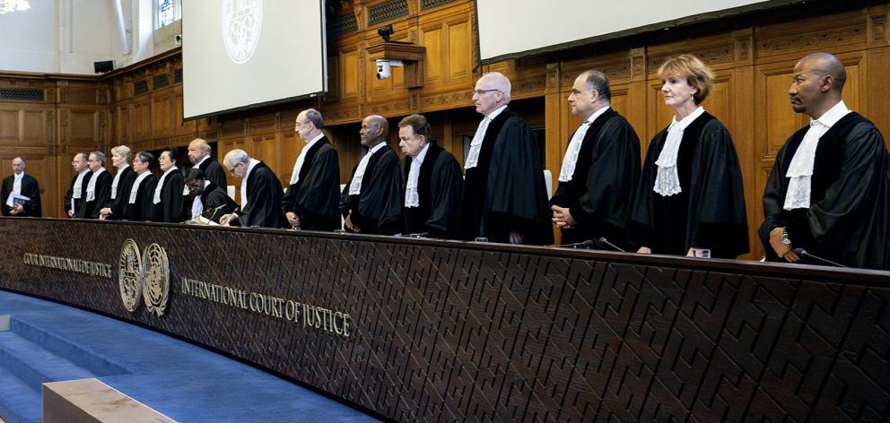 Judges rise before delivering a non-binding ruling on the legal consequences of the Israeli...