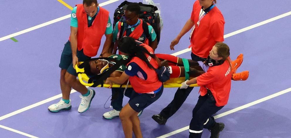 Ethiopia's Lamecha Girma was taken to hospital after falling heavily in the steeplechase. Photo:...