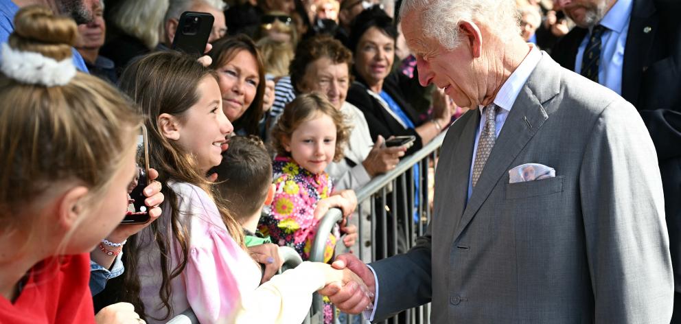 King Charles greets a member of the public after visiting Southport Town Hall this week. Photo:...