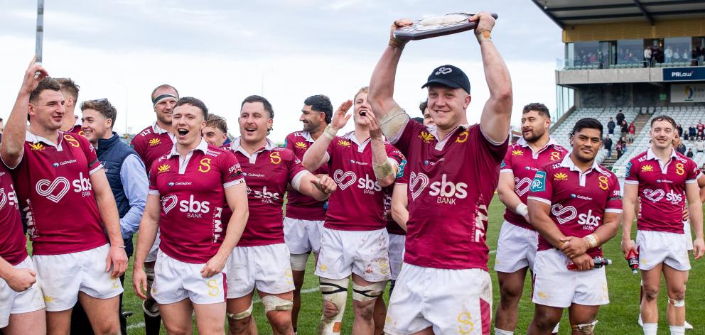 Southland captain Sean Withy hoists the Donald Stuart Memorial Shield after the NPC game in...