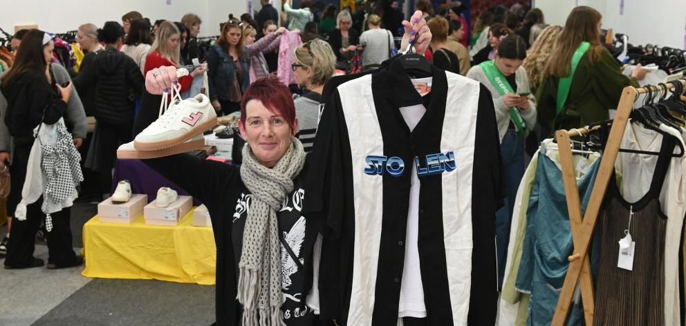 Tania Keane, of Dunedin, shows her haul at the fundraiser for the Otepoti Dunedin Whanau Refuge....