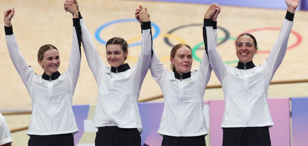 Silver medalists Ally Wollaston, Bryony Botha, Emily Shearman, Nicole Shields pose on the podium...