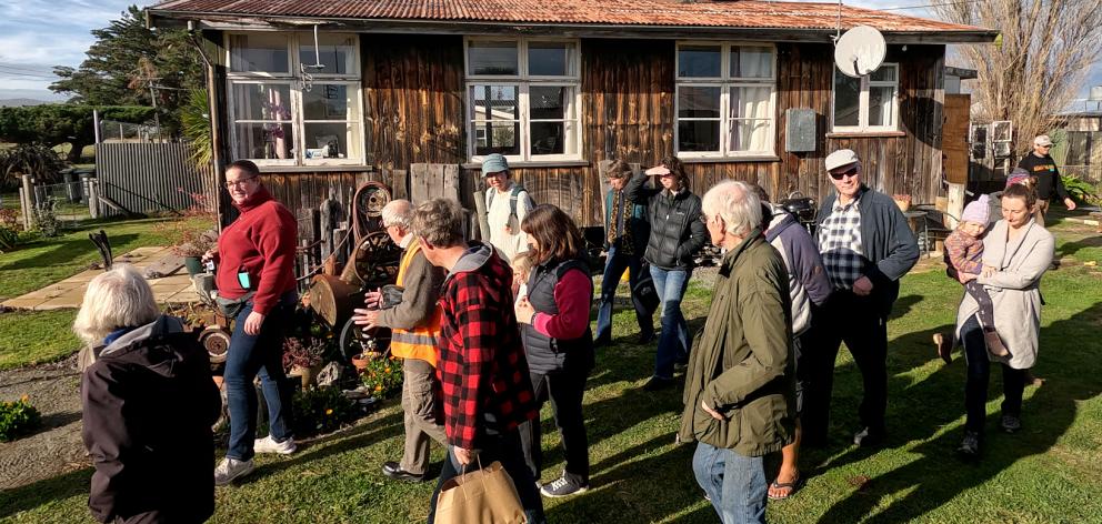 Visitors looking through one of the Greenpark Huts. Photo: Geoff Sloan