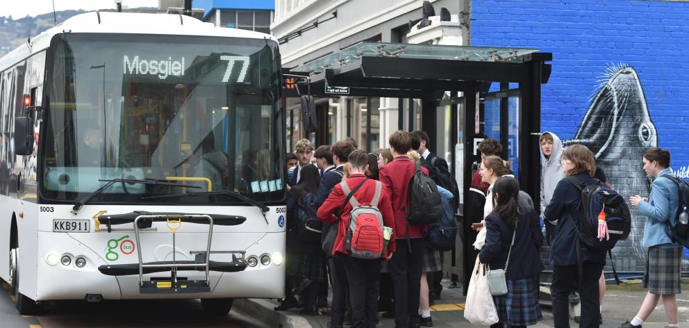 School students queuing to board the Mosgiel 77 bus on yesterday. PHOTO: GREGOR RICHARDSON