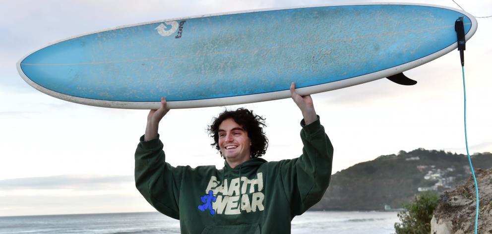 Fin Milne is pleased to get his board back after the encounter with the marine mammal. PHOTO:...