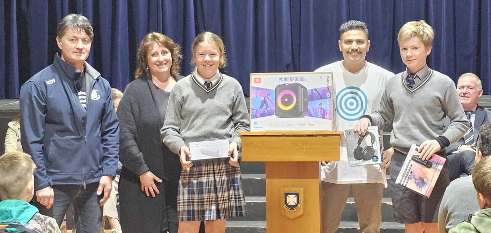 Accepting their prizes from Harvey Norman are (from left) Waihi School directors of music Al and...