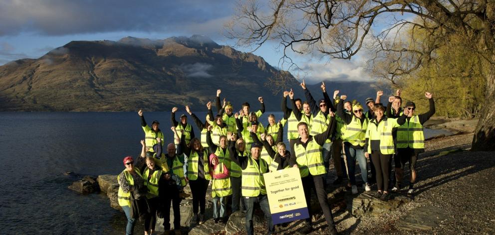 Level Group conference delegates pictured early yesterday before pitching in to do odd jobs for...