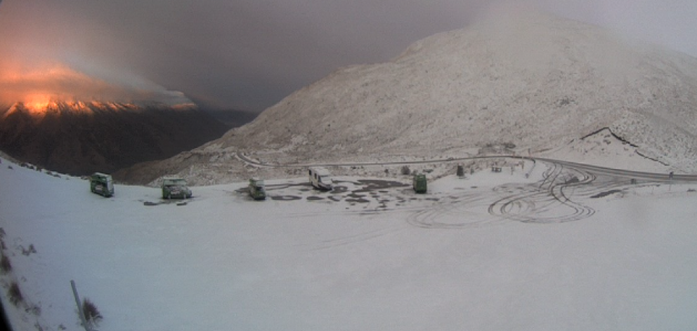 The sun rises over a snowy Crown Range summit this morning. Screengrab: MetService webcam