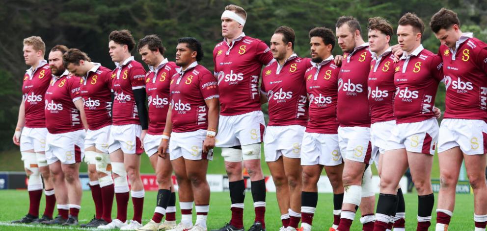 Southland players observe a moment of silence in memory of Norm Hewitt during the round five...