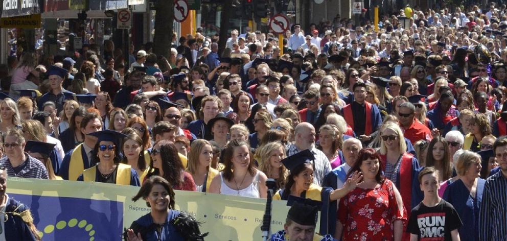 Graduands parade up George St during a previous graduation ceremony. PHOTOL: GERARD O’BRIEN