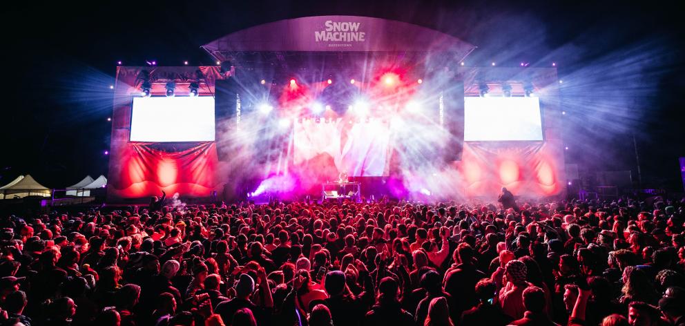 Lights shine out at a festival concert in Queenstown.