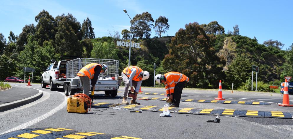 Downer contractors work on an Southern Motorway off-ramp intersection of State Highways 1 and 87...