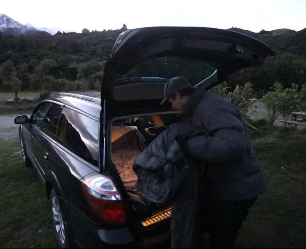 Mr van Onselen sets up his car to sleep in for three nights.