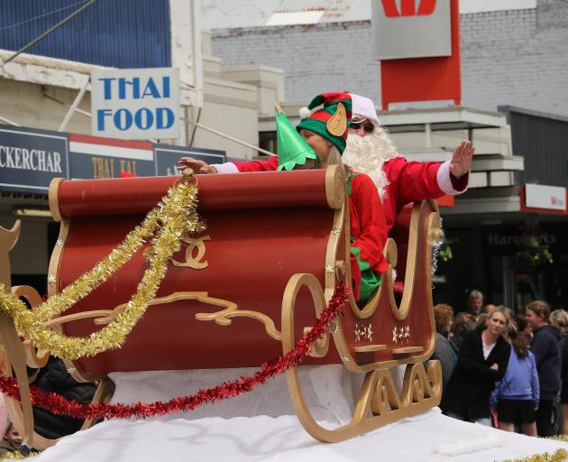 To the delight of many, Santa arrives at the parade in Balclutha on Saturday.