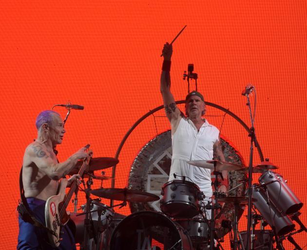 Flea (left) and drummer Chad Smith tump out the trademark rhythm section for the veteran...