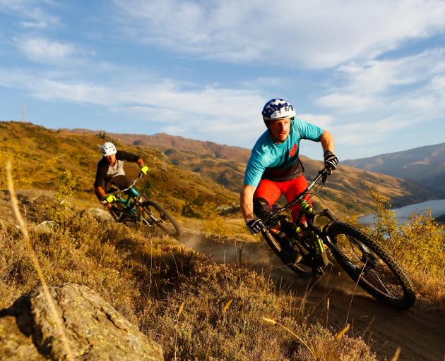 Jason Thomsen (left) and Jimmy Pollard ride some mountain-bike trails in Clyde, similar to the...