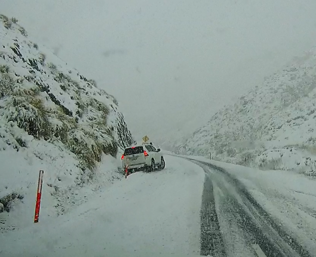 A car stuck on the Crown Range. Photo: QLDC