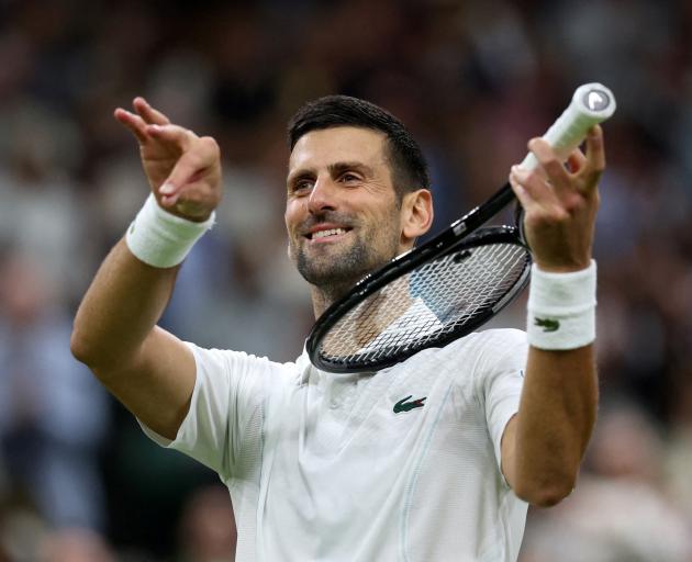 Novak Djokovic celebrates after winning his fourth round match against Denmark's Holger Rune....