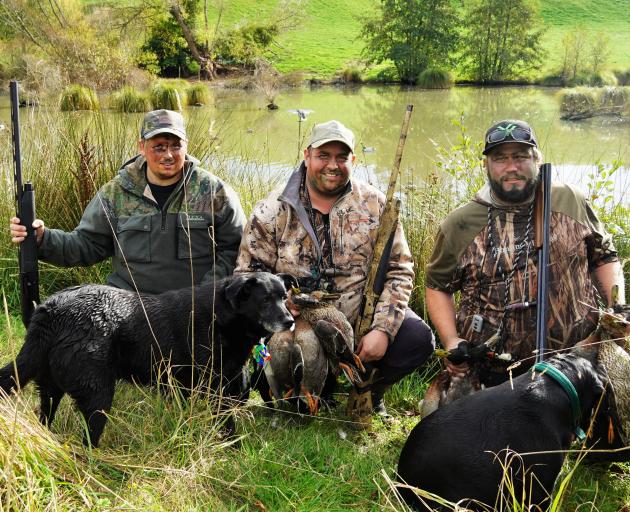 Duck-shooters (from left) Craig Hayward, of Mosgiel, and brothers James Mason, of Winton, and...