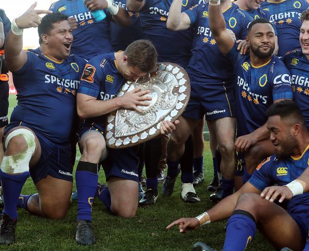 Otago's Michael Collins (C) and team mates celebrate with the Ranfurly Shield. Photo: Getty Images