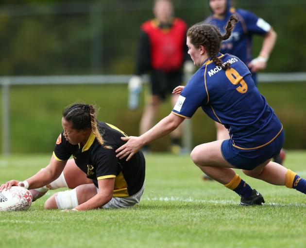 Joanah Ngan-Woo of Wellington scores a try under pressure from Otago's Rosie Buchanan-Brown....