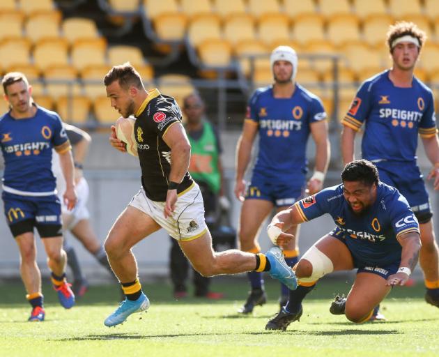 Wellington's Wes Goosen breaks away for one of his three tries at Westpac Stadium on Sunday....