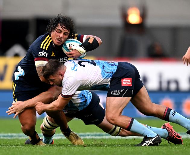  Daniel Lienert-Brown is hit in the tackle by Waratahs players. Photo: Getty Images