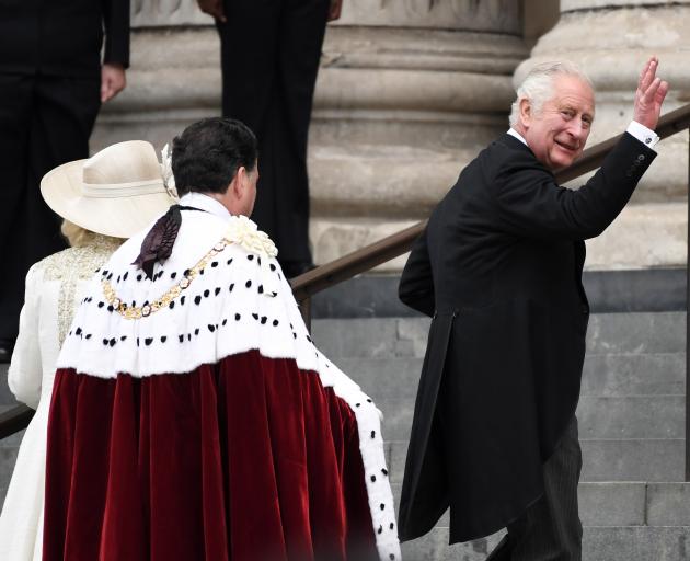 Prince Charles waves to the crowd before attending the service at St Paul's Cathedral in honour...