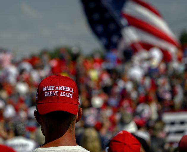 Supporters of Republican presidential candidate, former US President Donald Trump, wait for the...