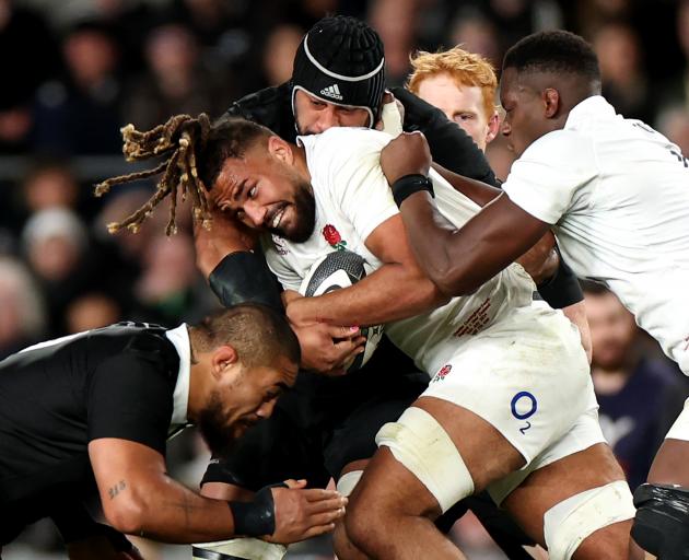 Chandler Cunningham-South of England is tackled during tonight's test match at Eden Park. Photo:...