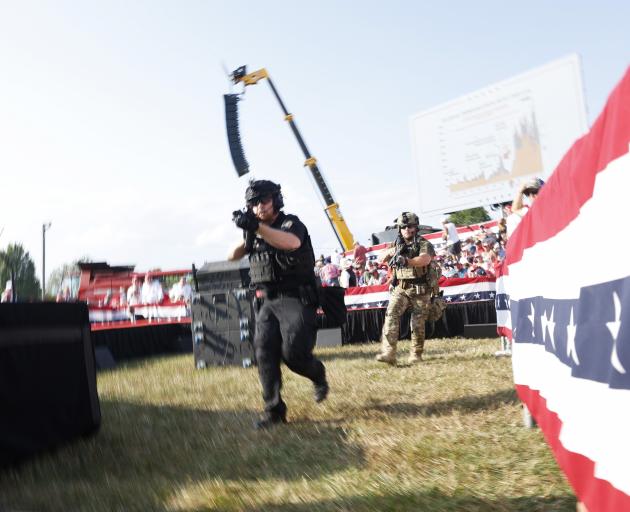 Law enforcement scramble to find the shooter after the incident. Photo: Getty Images