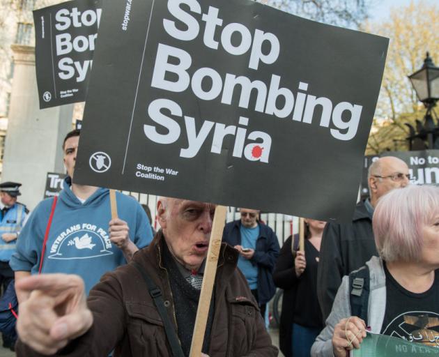 Protesters take part in a Stop the War Coalition demonstration opposite Downing St in London....