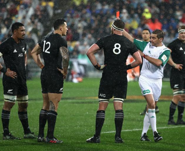 Referee Jerome Garces gives Sonny Bill Williams a red card, reducing the All Blacks to 14 men for...