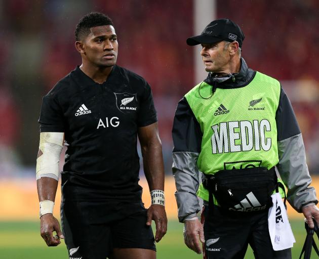 Waisake Naholo is escorted from the ground. He later failed a concussion test. Photo: Getty Images 