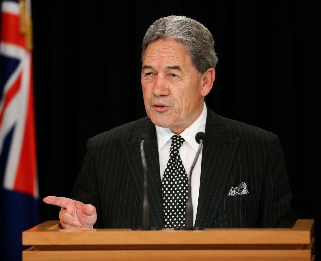 Winston Peters announces his decision to go with Labour last night. Photo: Getty Images 