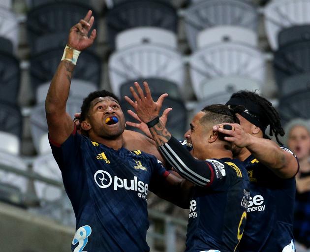 Waisake Naholo celebrates his try with teammates Aaron Smith and Aki Seiuli. Photo: Getty Images 