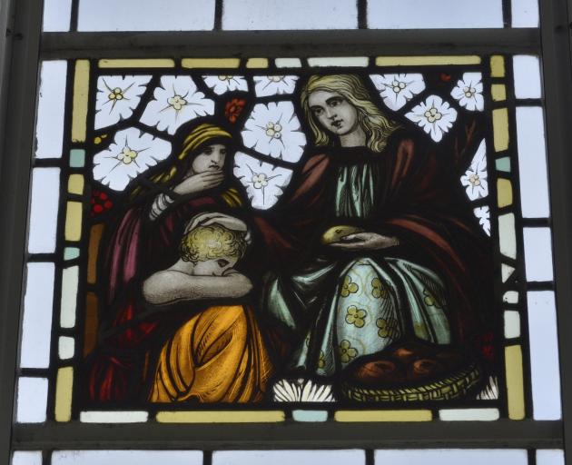 One of the home’s  three stained-glass windows. Designer John Brock moved from Melbourne to...