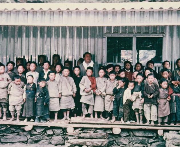 Khumjung School and its pupils in 1961 soon after the original aluminium classrooms were built by...