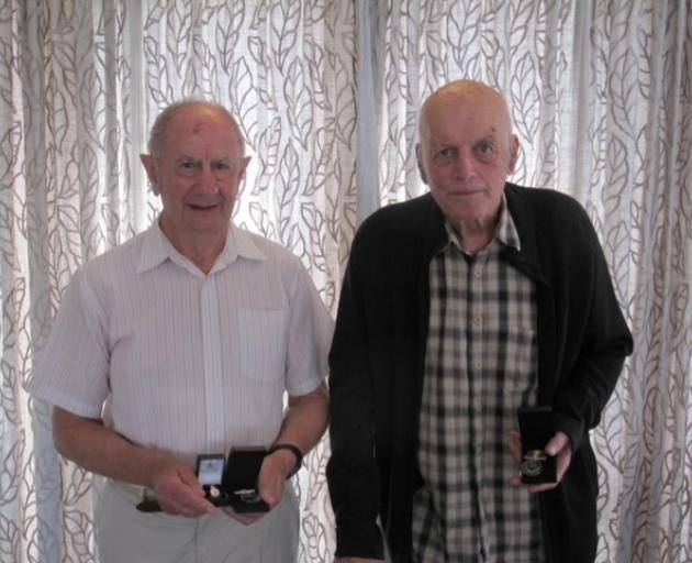 Mike Rossiter (left) and Ernest Robb’s son John with the Nuclear Test medals. Photo: Supplied