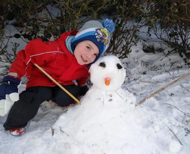 Robbie Gordon (4), of Opoho, reached the summit of Mt Cargill with a carrot and made a snowman...