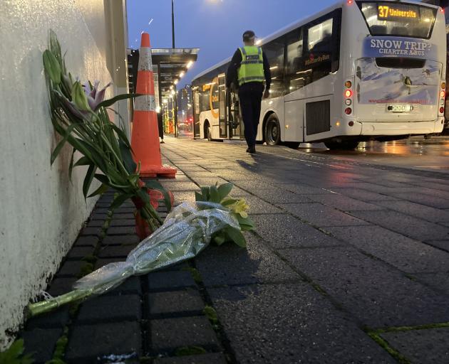 Flowers at the scene of the bus hub tragedy this morning. Photo: Stephen Jaquiery