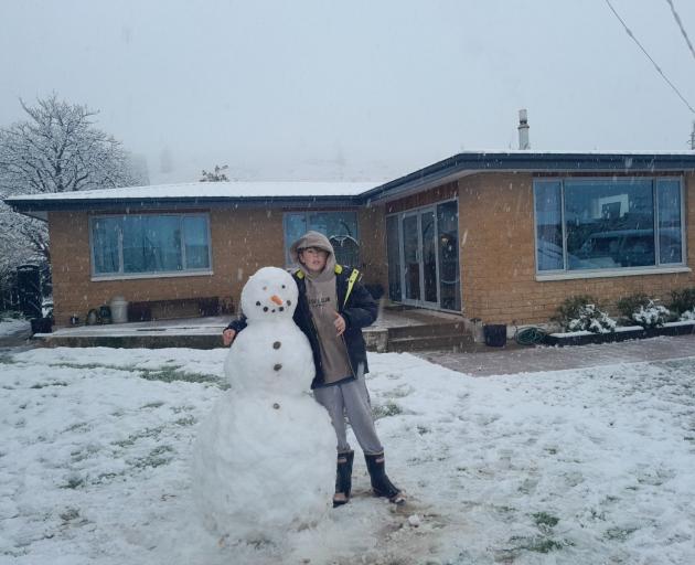 Jackson Hill, of Clyde, with his snowman. Photo: Ruby Shaw