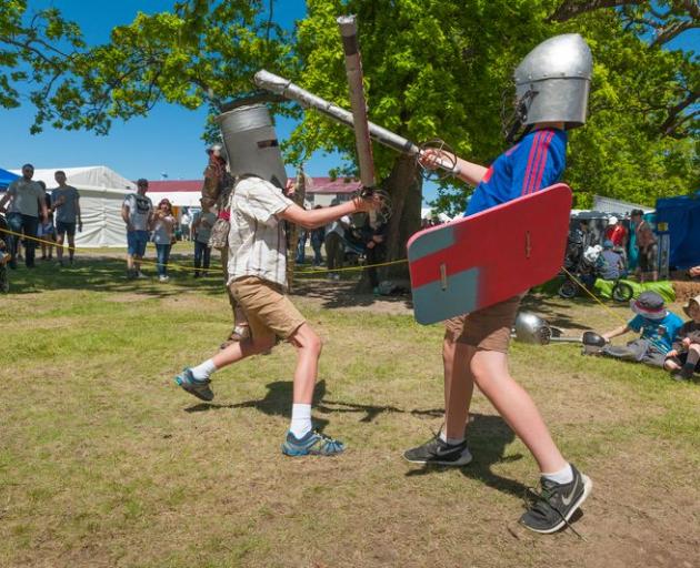 Children engaged in mock battle at the Hororata Highland Games. Photo: Hororata Community Trust