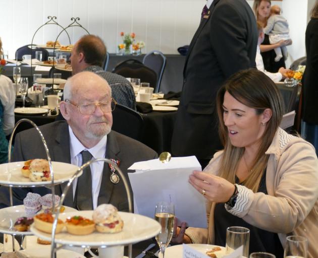 Taylor Reed and friend Rachel Thurston inspect a letter from the Governor-General.  