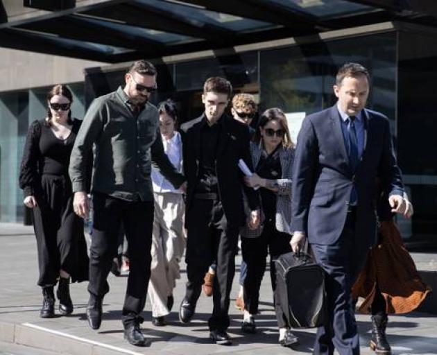 Adam Rapson leaves court with his supporters after an earlier hearing. Photo: George Heard