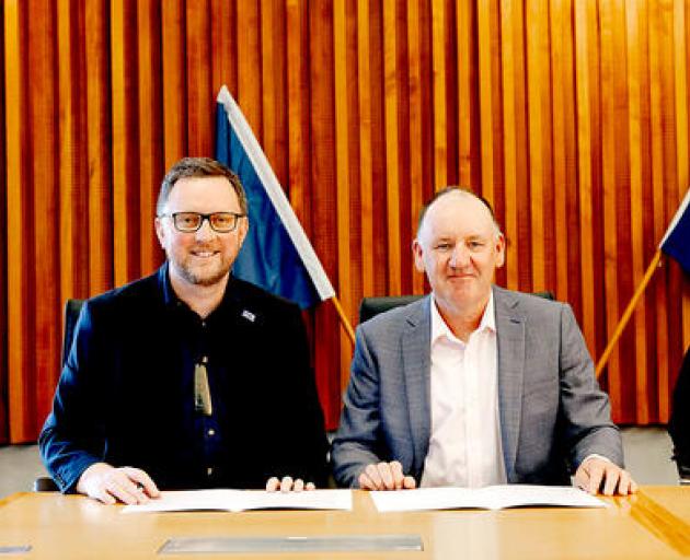 Mayor Sam Broughton and KiwiRail future state freight general manager Mark Heissenbuttel signing...