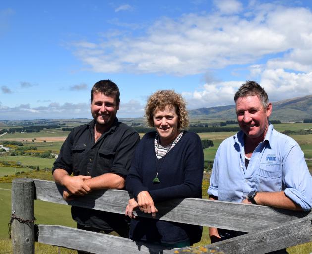 Leaning on a sheep pen at the top of the yarding course on the St Bathans Range are (from left)...