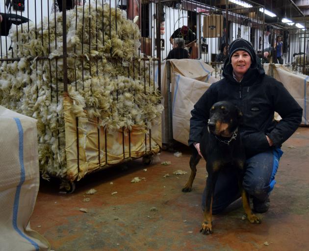 Glenaray Station block manager Nicky Thompson and her huntaway Maid in the 10-stand shearing shed...